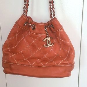 CHANEL Surpique Drawstring Bucket Bag